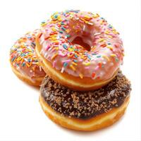Three assorted donuts with colorful icing and sprinkles, stacked together on a white background, perfect for dessert lovers. photo