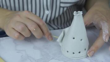 Process modeling teepee from modeling clay on marble table. Porcelain, creativity. Material for manufacture of ceramic products. Craft of sculptor. Concept of hobby and craft work. video