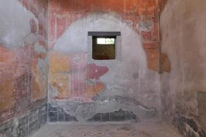 Ercolano, Italy, 2024 Well preserved wall paintings inside homes and palaces of Herculaneum were protected for 2000 years under the volcanic ash and pumice from the Mount Vesuvius eruption in 79 AD.. photo