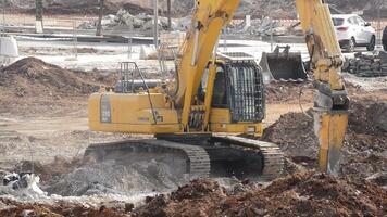 Malaga, Spain, 2017 - Hammer excavator working in the demolition of some buildings hitting debris video