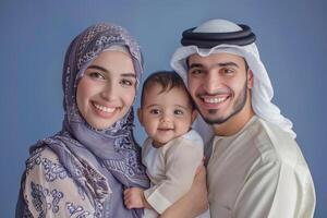 A happy middle muslim family against isolated vivid color background photo