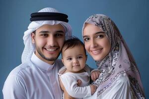 A happy middle muslim family against isolated vivid color background photo