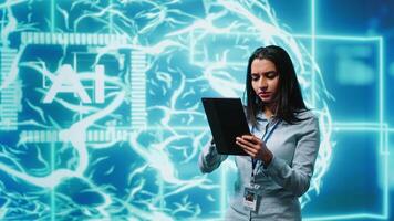 Developer using tablet to implement artificial intelligence parallel processing, breaking up complex computational tasks enabling AI systems to process more input data faster, camera A video