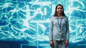 Portrait of smiling technician running artificial intelligence programming scripts. Joyful admin working in IT department tasked with AI applications development, camera A video