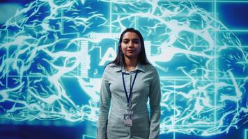 Portrait of smiling technician running artificial intelligence programming scripts. Joyful admin working in IT department tasked with AI applications development, camera B video