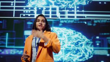 Speaker talking on stage in event bringing together leading experts, researchers, innovators and companies from around the globe to explore latest developments in AI and machine learning, camera B video