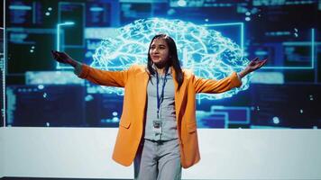 Speaker talking with world leading technology experts and innovators meeting at event to do deep dive into artificial intelligence technology. Expert showcasing latest innovations in AI, camera B video