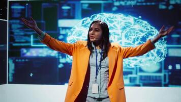 Lively speaker talks at AI event gathering tech startups managers, investors and academics. Expert hosts sessions geared towards helping IT business leaders tap into artificial intelligence, camera B video
