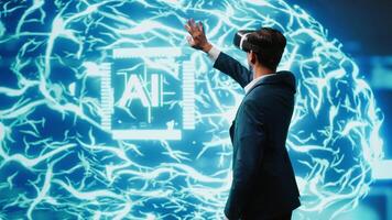 Computer scientist wearing VR headset looking at hologram of artificial intelligence human brain simulation. Indian man interacting with AI visualization showing machine learning algorithms, camera A video