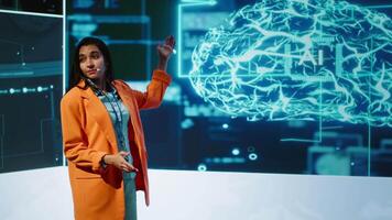 Speaker talking on stage in event bringing together leading experts, researchers, innovators and companies from around the globe to explore latest developments in AI and machine learning, camera A video