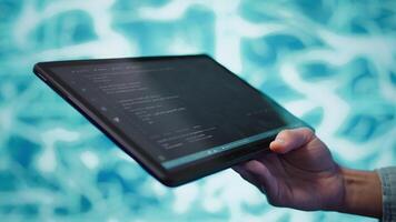 Software developer with tablet programming artificial intelligence computing simulating human brain. Close up of IT professional using device, building AI machine learning algorithms, camera B video