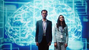 Admins using artificial intelligence computing simulating human brain thought processes in computerized model. Portrait of employees working with AI machine learning algorithms, camera B video