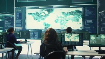 Cyber operations center with governmental hackers working on digital security activities during hybrid war. Specialists team ensuring security and malware detection, cyber surveillance. Camera B. video