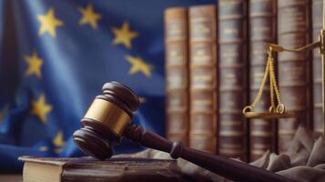 A judge's gavel with a blurred flag of European Union in the background. Background representing the European Union Legal System. photo