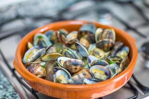 Portuguese Style Clams in a Terracotta Dish photo