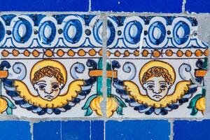 Cherubs on Glazed Ceramic Tiles at Fine Arts Museum Seville Daytime photo
