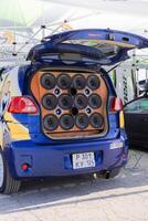 Russia, Novosibirsk, 23.06.2024, toyota porte with pikachu sticker and powerful audio speakers are installed in the trunk of the car. back view photo