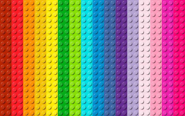 Many plastic building toy blocks background. Wallpaper of bricks in different colors. Close-up of a colorful bricks viewed from above. Abstract background illustration