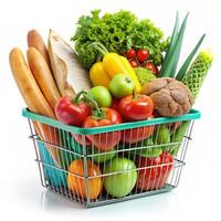 Basket full of groceries and vegetables isolated on a white background photo