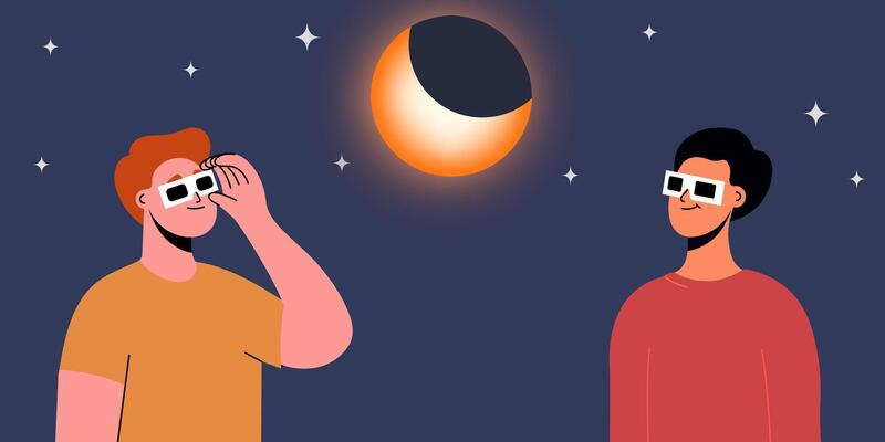 A group of people wearing safety glasses watch a partial solar eclipse
