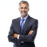 Smiling male professional standing with arms crossed while making eye contact against isolated background photo