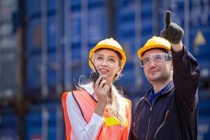 Customs worker team working in Port Cargo Shipping Container Yard together, Radio Loading Control Operate. photo