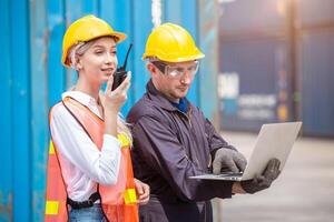 Customs worker team working in Port Cargo Shipping Container Yard together, Radio Loading Control Operate. photo