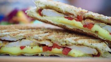 sandwich or toast with sausage served on a plate on tiles background video