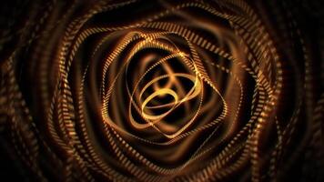 Looped background with transparent golden ribbons in a shape of abstract circles floating in zero gravity. Glowing yellow stripes smoothly morphing with soft shine effect. Seamless vj loop , 4k 60fps video