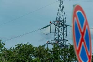 High voltage towers with sky background. Power line support with wires for electricity transmission. High voltage grid tower with wire cable at distribution station. Energy industry, energy saving photo