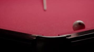 Close-up of a failed shot on a white pool ball for playing billiards in the Russian style. Close up. Slow motion video