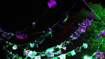 Colorful decorations that shimmer with different colors in the open air video
