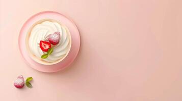 Sweet creme brulee dessert with strawberry topping on bowl isolated pink background photo