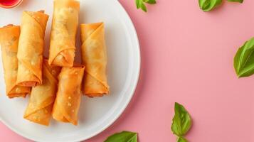 Flat lay fried spring roll crunchy snack homemade on white plat isolated pink photo