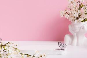 Empty podium or pedestal with spring bloom. Spring mock up for cosmetic products photo