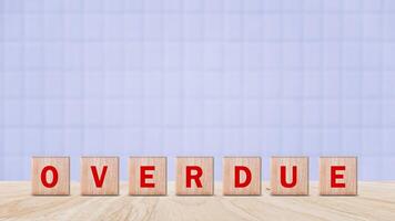 Overdue, Wooden on the office desk, informative and communication background, Word OVERDUE made with wood building blocks, OVERDUE word on block concept. photo