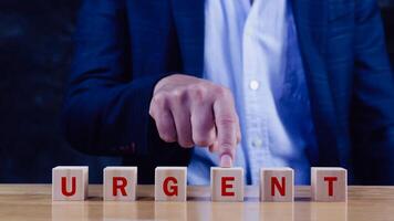 URGENT, Wooden blocks with URGENT text and Business concept, informative and communication background, Urgent Notice Important Quick Serious Speed Concept. photo