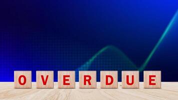 Overdue, Wooden on the office desk, informative and communication background, Word OVERDUE made with wood building blocks, OVERDUE word on block concept. photo
