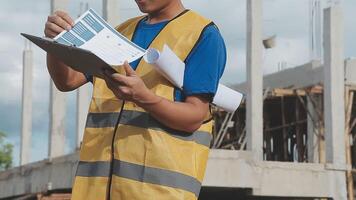 Construction worker, tablet and portrait of man with research and digital data for solar panel installation. Happy, engineer and male contractor with eco and energy project with tech and online plan video