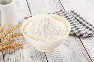 Wheat flour heap for bake photo
