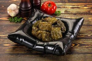 Stuffed dolma - meat in grape leaves photo