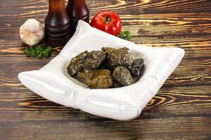Stuffed dolma - meat in grape leaves photo