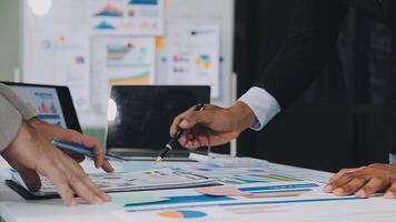 Business meeting time,business account managers crew working with new startup project,report analysis cost graph on desk at meeting room. video