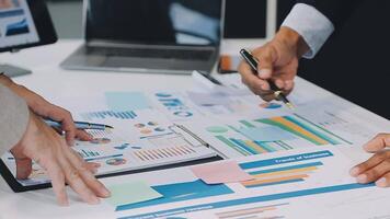 Business meeting time,business account managers crew working with new startup project,report analysis cost graph on desk at meeting room. video