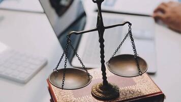 Judge gavel with Justice lawyers having team meeting at law firm background. Concepts of Law and Legal services. video