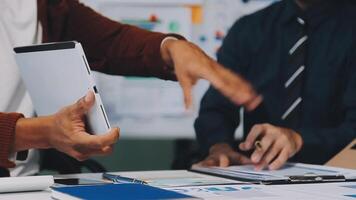 Business meeting time,business account managers crew working with new startup project,report analysis cost graph on desk at meeting room. video