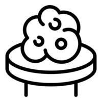 Round coffee table with irregular shape top being decorated with flower arrangement vector