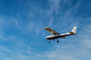 Herzliya, Israel. May 1, 2023. CESSNA 172M SKYHAWK with cloud sky landing configuration, copy space. photo