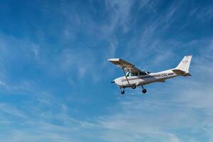 Herzliya, Israel. May 1, 2023. CESSNA 172M SKYHAWK with cloud sky landing configuration, copy space. photo
