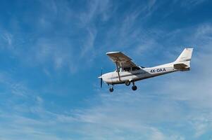 Herzliya, Israel. May 1, 2023. CESSNA 172M SKYHAWK with cloud sky landing configuration, copy space. photo